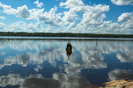 KRASNY BRONEVIK, RUSSIA - JULY 7, 2014: Celebrations commemorating the Rev. Anthony Dymsky (died 1224) in Antony Dymsky Monastery - Procession on Lake Dymsky, the great blessing of water and bathing.のeditorial素材