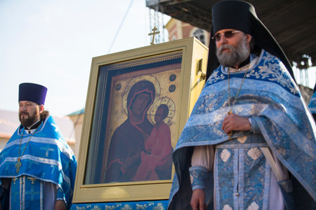 TIKHVIN, RUSSIA - JULY 9, 2014: Unidentified participants Orthodox divine Liturgy on the occasion celebrations of the 10th anniversary of the return of the Tikhvin icon of the Mother of God in Uspensky monastery.のeditorial素材