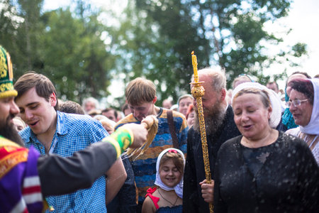 KRASNY BRONEVIK, RUSSIA - JULY 7, 2014: Celebrations commemorating the Rev. Anthony Dymsky (died 1224) in Antony Dymsky Monastery - Procession on Lake Dymsky, the great blessing of water and bathing.のeditorial素材