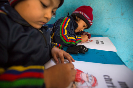 KATHMANDU, NEPAL - DEC 24, 2013: Unknown pupils in English class at primary school. Only 50% of  children in Nepal can reach 5 grade.のeditorial素材
