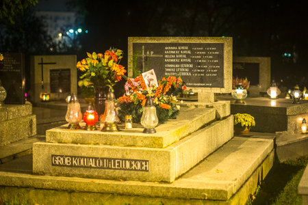 KRAKOW, POLAND - NOV 1, 2014: The evening before All Saints Day on Rakowicki Cemetery. Founded at beginning of the 19th century is one of the best known cemeteries of Poland.のeditorial素材