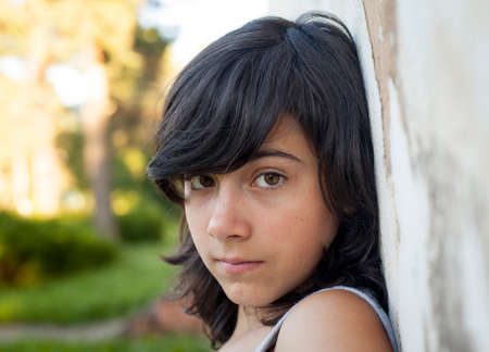 Closeup portrait of young nice girl outdoors.