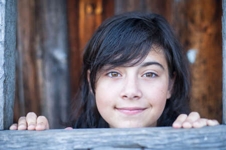 Teen girl portrait outdoors in a park.の写真素材