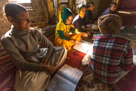 KATHMANDU, NEPAL - DEC 9, 2013: Unknown students in lesson at Jagadguru School. School established at 2013, to let new generation learn Sanskrit and preserve Hindu culture.のeditorial素材