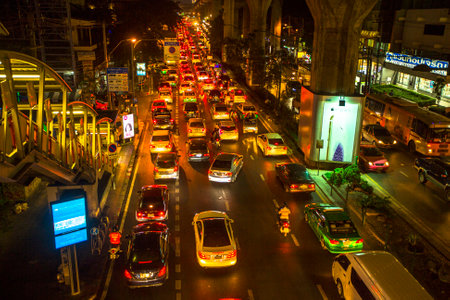 BANGKOK, THAILAND - DEC 18, 2014: Traffic jam in city centre at night. Bangkok's traffic problem getting worse, since government in 2012 y. introduced a policy to refund tax for first-time car buyers.のeditorial素材