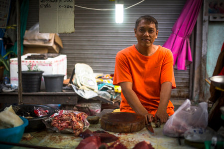 BANGKOK, THAILAND - DEC 15, 2014: Unidentified man seller on the Burmese street market in Bangkok. There is 16,000 registered street vendors in Bangkok.のeditorial素材