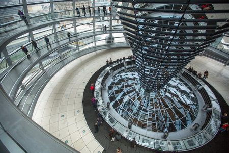 BERLIN, GERMANY - NOV 15, 2014: People visit the modern dome on the roof of the Reichstag. It is a glass dome constructed on top of rebuilt Reichstag - Germany's parliament building.のeditorial素材