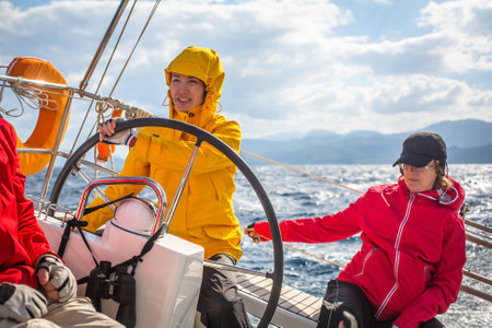 HYDRA, GREECE - CIRCA OCT, 2014: Unidentified sailors participate in sailing regatta 12th Ellada Autumn 2014 among Greek island group in the Aegean Sea, in Cyclades and Argo-Saronic Gulf.のeditorial素材