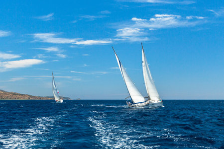 HYDRA, GREECE - CIRCA OCT, 2014: Unidentified sailboats participate in sailing regatta 12th Ellada Autumn 2014 among Greek island group in the Aegean Sea, in Cyclades and Argo-Saronic Gulf.のeditorial素材