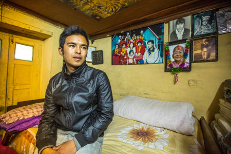 BHAKTAPUR, NEPAL - CIRCA DEC, 2013: Unidentified poor people in his house. The caste system is still intact today but the rules are not as rigid as they were in the past.のeditorial素材