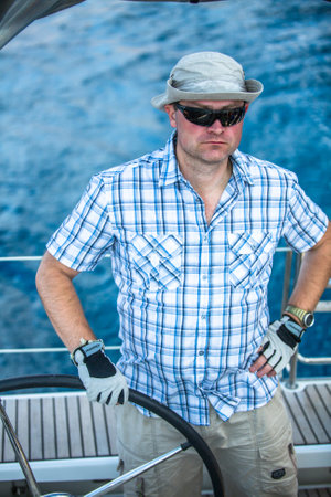 HYDRA, GREECE - CIRCA OCT, 2014: Sailors participate in sailing regatta 12th Ellada Autumn 2014 among Greek island group in the Aegean Sea, in Cyclades and Argo-Saronic Gulf.のeditorial素材