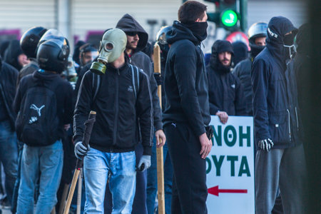 ATHENS, GREECE - APR 16, 2015: Leftist and anarchist groups seeking the abolition of new maximum security prisons, clashed with riot police, who responded with tear gas and stun grenades.のeditorial素材