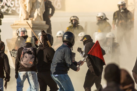 ATHENS, GREECE - APR 16, 2015: Anarchist protesters near Athens University, which has been occupied...