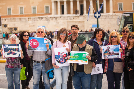ATHENS, GREECE - APR 18, 2015: Unidentified protesters during the World Day of Action against TTIP CETA TISA, (Transatlantic Trade and Investment Partnership) in Athens near presidential Palace.のeditorial素材