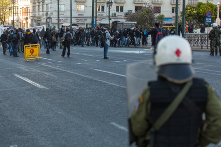 ATHENS, GREECE - APR 16, 2015: Leftist and anarchist groups seeking the abolition of new maximum security prisons, clashed with riot police, who responded with tear gas and stun grenades.のeditorial素材
