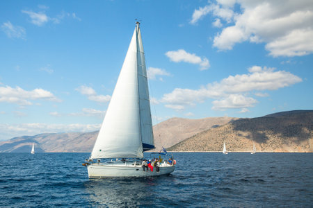 HYDRA, GREECE - CIRCA OCT, 2014: Sailboat participate in sailing regatta 12th Ellada Autumn 2014 among Greek island group in the Aegean Sea, in Cyclades and Argo-Saronic Gulf.のeditorial素材