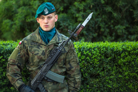 KRAKOW, POLAND - OCT 3, 2015: Polish soldiers at ceremony of laying flowers to monument to Hugo Kollataj during annual Polish national and public holiday the May 3rd Constitution Day (of May 3, 1791)のeditorial素材