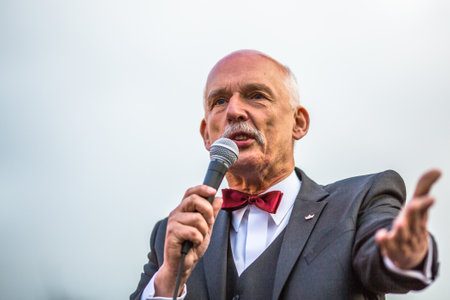KRAKOW, POLAND - APR 29, 2015: Janusz Korwin-Mikke or JKM, is a conservative liberal Polish politician, during pre-election rally of presidential candidate of Poland, on main square Krakow.のeditorial素材