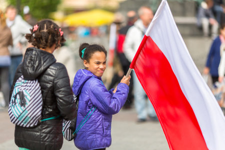KRAKOW, POLAND - MAY 2, 2015: During Flag Day of the Republic of Polish - is national festival introduced by the Act of 20 Feb 2004. On the same day is celebrated Day of Polonia and Poles Abroad.のeditorial素材