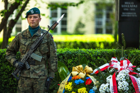 KRAKOW, POLAND - OCT 3, 2015: Polish soldiers at ceremony of laying flowers to monument to Hugo Kollataj during annual Polish national and public holiday the May 3rd Constitution Day (of May 3, 1791)のeditorial素材