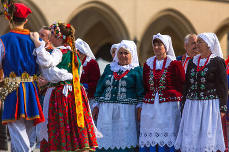 KRAKOW, POLAND - MAY 3, 2015: Polish folk collective on Main square during annual Polish national and public holiday the Constitution Day - May 3, 1791 was adopted first Constitution of modern Europe.のeditorial素材