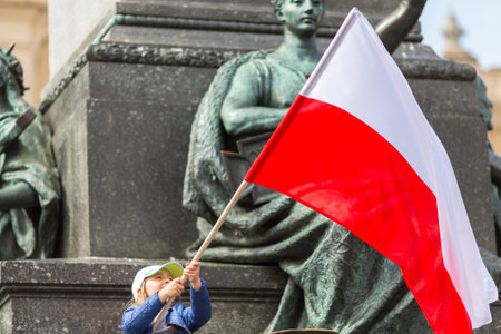 KRAKOW, POLAND - MAY 2, 2015: During Flag Day of the Republic of Polish - is national festival introduced by the Act of 20 Feb 2004. On the same day is celebrated Day of Polonia and Poles Abroad.のeditorial素材