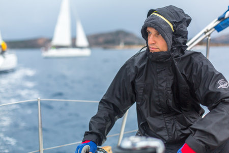 PYLOS, GREECE - CIRCA OCT, 2014: Sailors participate in sailing regatta 12th Ellada Autumn 2014 among Greek island group in the Aegean Sea, in Cyclades and Argo-Saronic Gulf.のeditorial素材