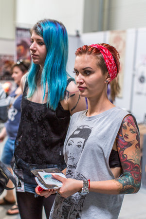 KRAKOW, POLAND - JUNE 6, 2015: Unidentified participants at 10-th International Tattoo Convention in Congress-EXPO Center. This year anniversary TattooFest - tattoo Studio is with an area of 2000m2のeditorial素材