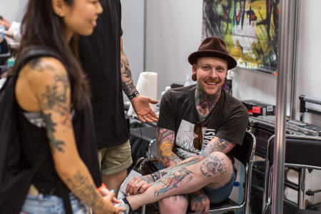 KRAKOW, POLAND - JUNE 6, 2015: Unidentified participants at 10-th International Tattoo Convention in Congress-EXPO Center. This year anniversary TattooFest - tattoo Studio is with an area of 2000m2のeditorial素材