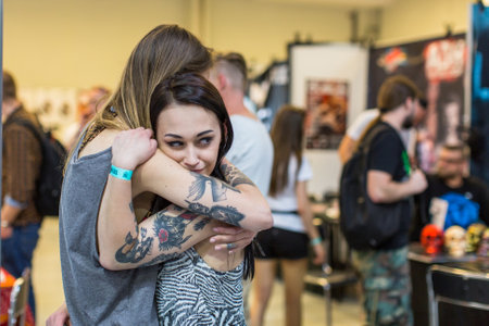 KRAKOW, POLAND - JUNE 6, 2015: Unidentified participants at 10-th International Tattoo Convention in Congress-EXPO Center. This year anniversary TattooFest - tattoo Studio is with an area of 2000m2のeditorial素材