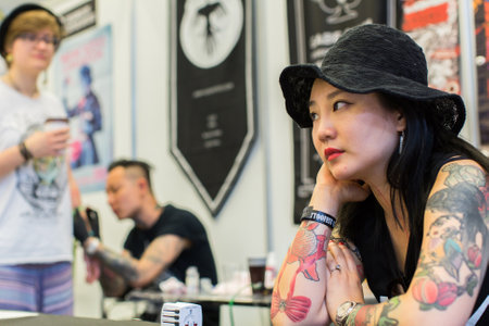 KRAKOW, POLAND - JUNE 6, 2015: Unidentified participants at 10-th International Tattoo Convention in Congress-EXPO Center. This year anniversary TattooFest - tattoo Studio is with an area of 2000m2のeditorial素材