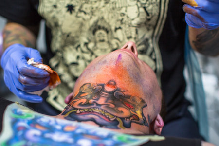 KRAKOW, POLAND - JUNE 6, 2015: Unidentified participants at 10-th International Tattoo Convention in Congress-EXPO Center. This year anniversary TattooFest - tattoo Studio is with an area of 2000m2のeditorial素材