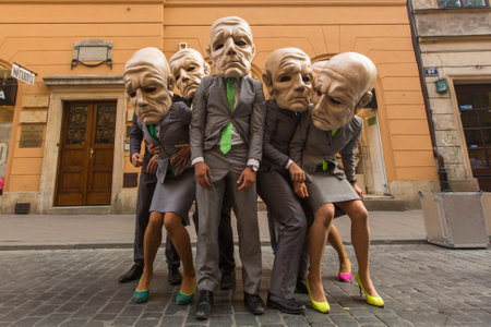 KRAKOW, POLAND - JUL 12, 2015: Participants at the annually (Jul 9-12) 28th International Festival of Street Theatres - Teatr KTO (PL) Peregrinus in Main Square and at random points around the city.のeditorial素材