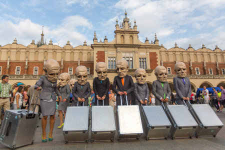 KRAKOW, POLAND - JUL 12, 2015: Participants at the annually (Jul 9-12) 28th International Festival of Street Theatres - Teatr KTO (PL) Peregrinus in Main Square and at random points around the city.のeditorial素材