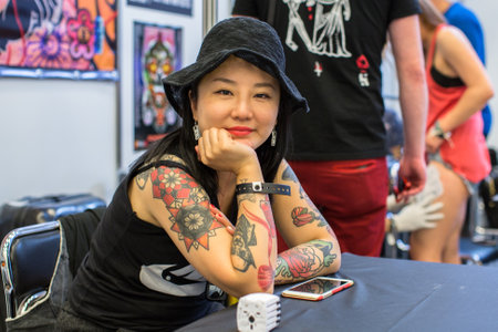 KRAKOW, POLAND - JUNE 6, 2015: Unidentified participants at 10-th International Tattoo Convention in Congress-EXPO Center. This year anniversary TattooFest - tattoo Studio is with an area of 2000m2のeditorial素材