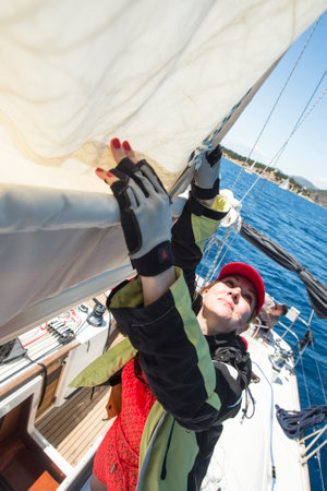 POROS - ERMIONI, GREECE - CIRCA MAY, 2014: Sailors participate in sailing regatta 11th Ellada 2014 among Greek island group in the Aegean Sea, in Cyclades and Argo-Saronic Gulf.のeditorial素材