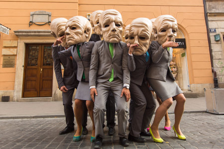 KRAKOW, POLAND - JUL 12, 2015: Participants at the annually (Jul 9-12) 28th International Festival of Street Theatres - Teatr KTO (PL) Peregrinus in Main Square and at random points around the city.のeditorial素材
