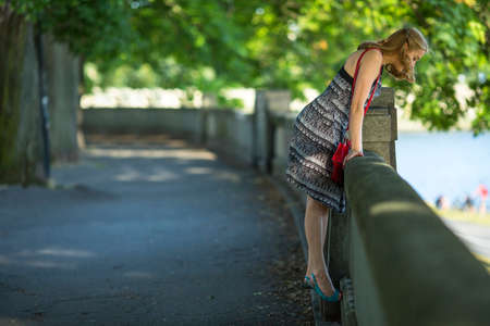 Young beautiful woman in the city Park.の写真素材