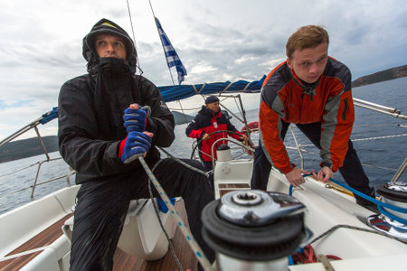 PYLOS, GREECE - CIRCA OCT, 2014: Sailors participate in sailing regatta 12th Ellada Autumn 2014 among Greek island group in the Aegean Sea, in Cyclades and Argo-Saronic Gulf.のeditorial素材