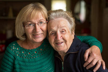 Portrait of an adult woman with his elderly mother.