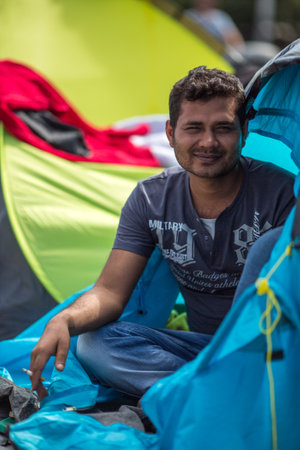 KOS, GREECE - SEP 28, 2015: Unidentified war refugee. More than half are migrants from Syria, but there are refugees from other countries -Afghanistan, Pakistan, Iraq, Iran, Mali, Somalia.のeditorial素材