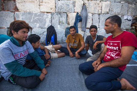 KOS, GREECE - SEP 28, 2015: Unidentified refugees. More than half are migrants from Syria, but there are refugees from other countries - Afghanistan, Pakistan, Iraq, Iran, Mali, Bangladesh, Eritrea.のeditorial素材