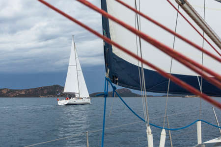 Sailing. Sailboats in sailing regatta on Aegean Sea. Ship yachts with white sails in the open Sea....