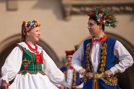 KRAKOW, POLAND - MAY 3, 2015: Polish folk collective on Main square during annual Polish national and public holiday the Constitution Day - May 3, 1791 was adopted first Constitution of modern Europe.のeditorial素材