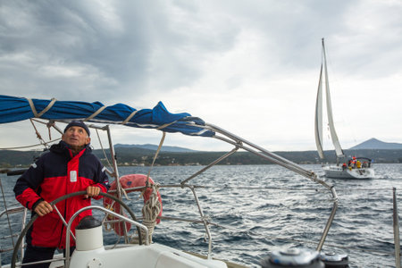 PYLOS, GREECE - CIRCA OCT, 2014: Sailors participate in sailing regatta 12th Ellada Autumn 2014 among Greek island group in the Aegean Sea, in Cyclades and Argo-Saronic Gulf.のeditorial素材
