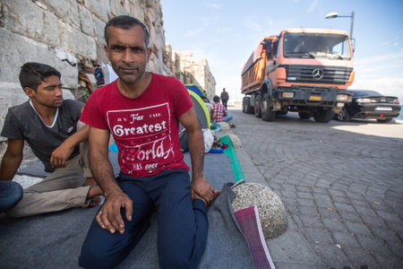 KOS, GREECE - SEP 28, 2015: Unidentified refugees. More than half are migrants from Syria, but there are refugees from other countries - Afghanistan, Pakistan, Iraq, Iran, Mali, Bangladesh, Eritrea.のeditorial素材