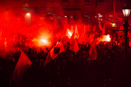 KRAKOW, POLAND - NOV 11, 2015: Protesters march through center of city. About 3.000 people took part...