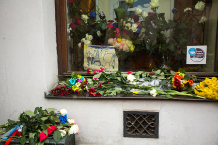 KRAKOW, POLAND - NOV 16, 2015: People put candles and flowers near the General Consulate of the French Republic to Krakow. Mourning for the victims of the terrorist attacks in Paris 13 Nov 2015.のeditorial素材