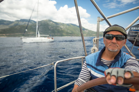 MONEMVASIA, GREECE - CIRCA MAY, 2014: Sailor participate in sailing regatta 11th Ellada 2014 Spring among Greek island group in the Aegean Sea, in Cyclades and Argo-Saronic Gulf.のeditorial素材