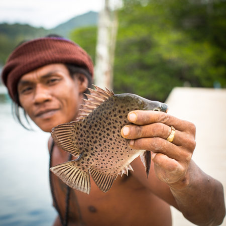 KOH CHANG - THAILAND - DEC 22, 2015: Unidentified local man in fisherman's village. Island is on Gulf of Thailand, near border with Cambodia, population of 5356 people living in 8 villages.のeditorial素材